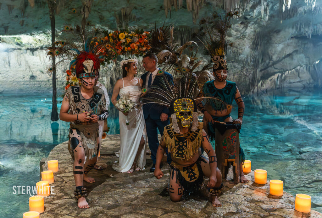mayan ceremony. the couple posing with the traditional musicians