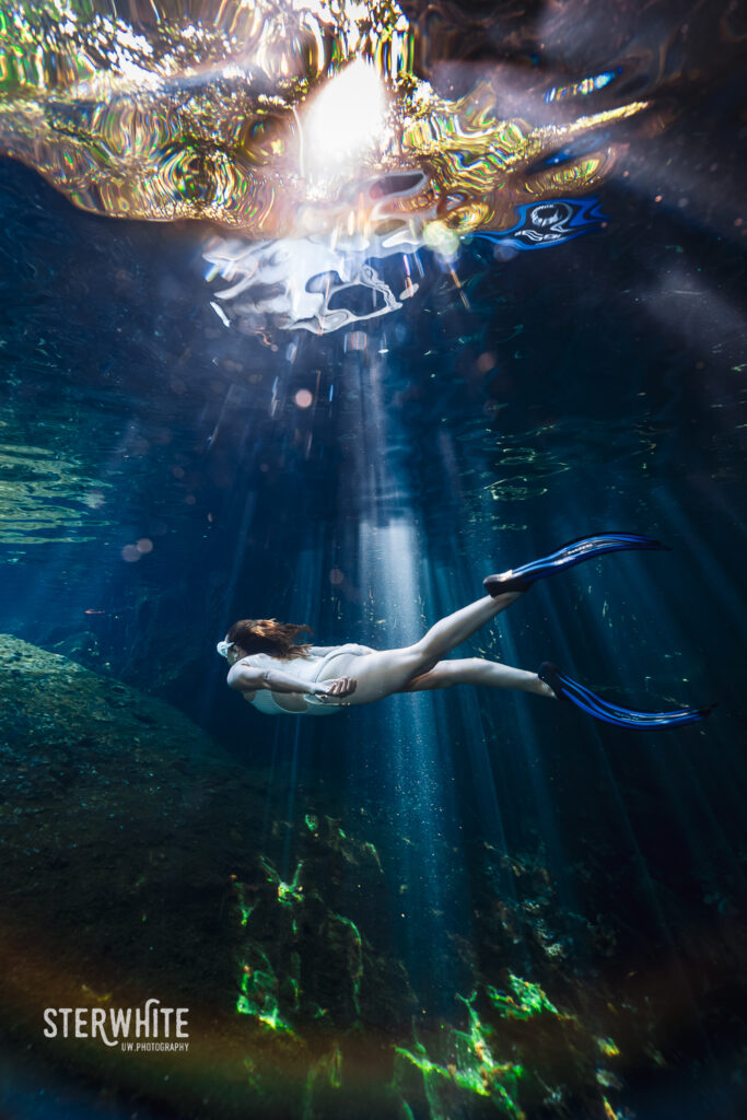 freediver woman during an underwater cenote photoshoot with Esther White
